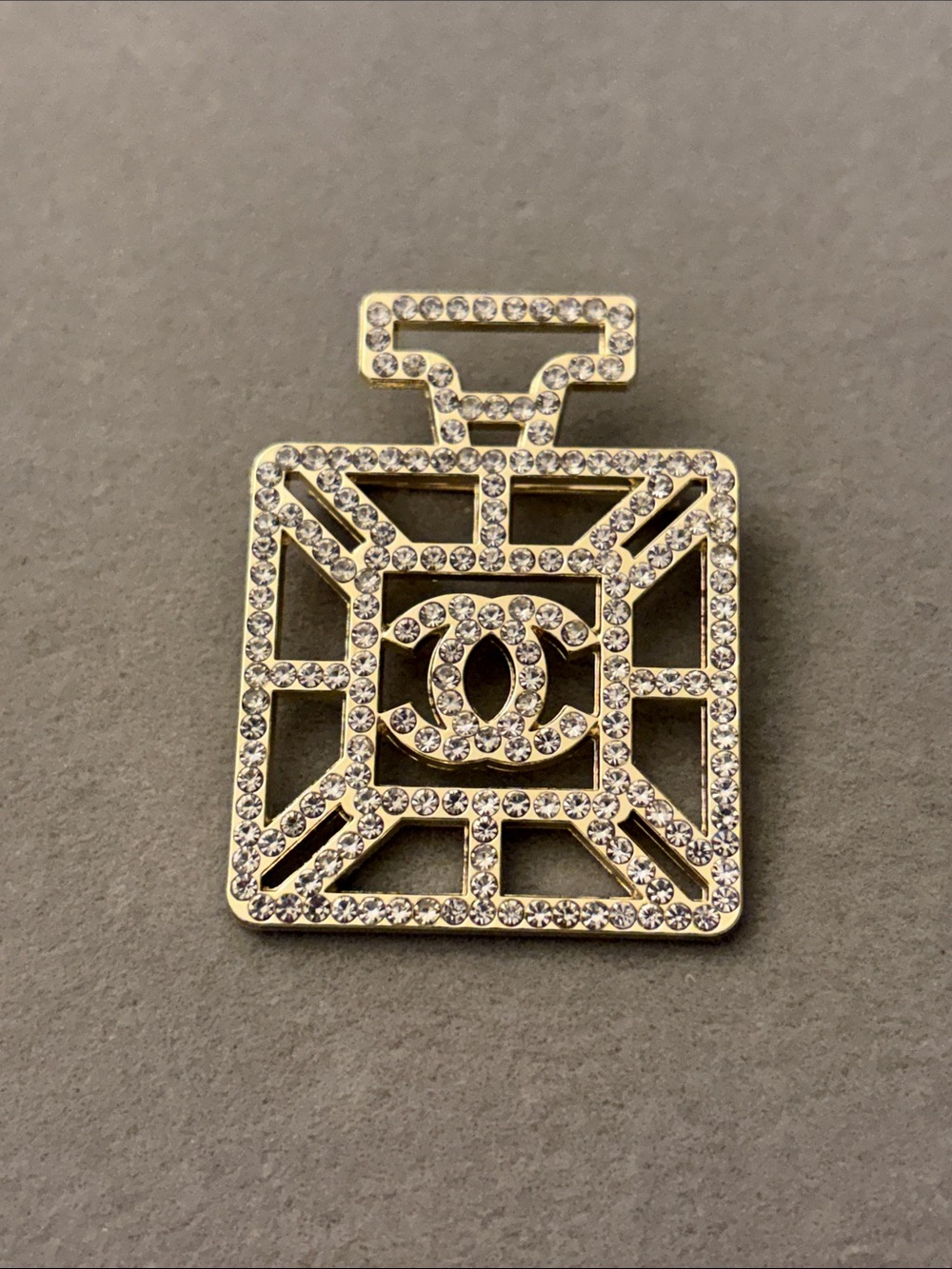 Gold-Tone Crystal Perfume Bottle Brooch with Interlocking Logo